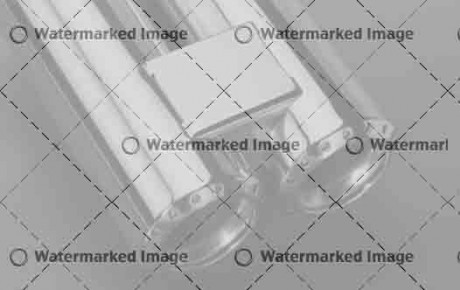 studio shot of a chrome double exhaust pipe in dark blue back